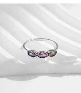 Detailed view of vintage S925 silver ring featuring three colorful oval crystal stones