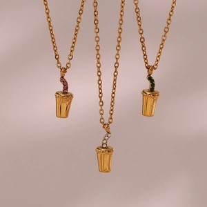 Detailed view of three 18K gold plated beverage cup pendants with colorful zircon inlay