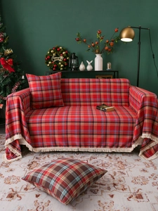 Detail of red Christmas plaid sofa throw with white tassels and matching pillowcase set