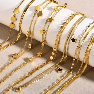 Gold stainless steel layered bracelets with heart, star pendants and flat snake chain