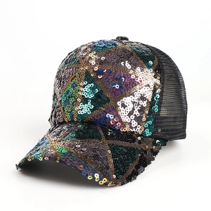 Detail of colorful sequin geometric patterns and breathable black mesh on baseball cap