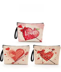 Detailed pattern display of three canvas makeup bags with red heart and love motifs