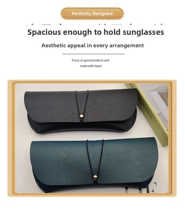 Detail of portable PVC leather sunglasses pouches in black and dark green finishes