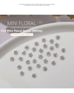 Close-up of 3.5x3mm mini metal flower nail charms with sparkling rhinestones for DIY art