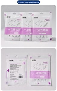 Close-up of two-pack disposable white non-woven pillowcases sized 50x80cm for travel
