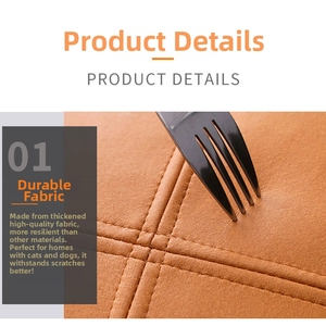Detail shot showing scratch-resistant orange tech fabric pillow cover with cross stitching
