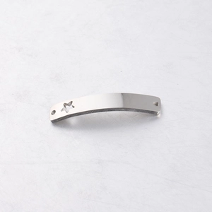 Close-up of a curved silver stainless steel connector bar with a hollow star and two holes