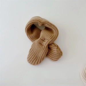 Close-up of khaki ribbed knit texture on soft winter warm scarf for babies