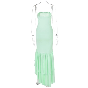 Detail of mint green strapless dress featuring asymmetric tiered ruffle hem and mermaid style