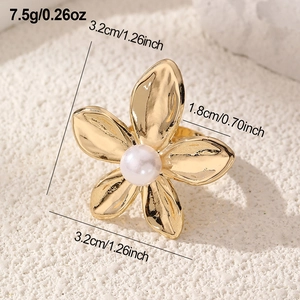 Detail view of a vintage gold floral open ring with white pearl and size specifications