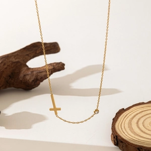 Minimalist 18K gold-plated stainless steel cross necklace with zircon stone on wood