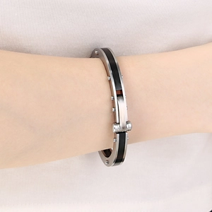 Punk unisex silver stainless steel cuff bracelet with black carbon fiber inlay on wrist