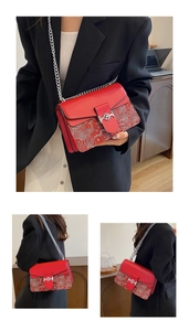 Elegant red chain handbag with intricate oriental floral pattern shown from various angles on model