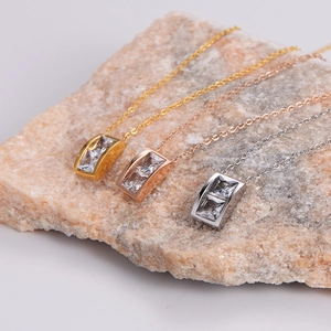 Exquisite square crystal pendant necklaces in gold, rose gold and silver on stone