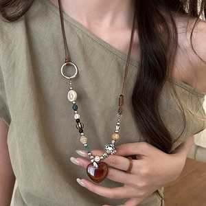 Bohemian long beaded necklace with brown heart pendant and mixed stone beads for women