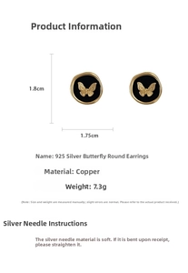 Detailed view of vintage metal butterfly earrings with 925 silver needle and gold relief