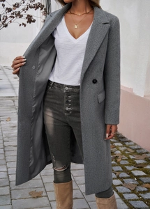 Close-up of grey long coat featuring a classic lapel collar and black single-breasted buttons