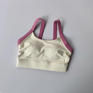 Detail of sports bra with ivory and burgundy contrast design and wide hem support