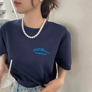 Classic navy blue crew neck T-shirt with inspirational quote print shown in street style