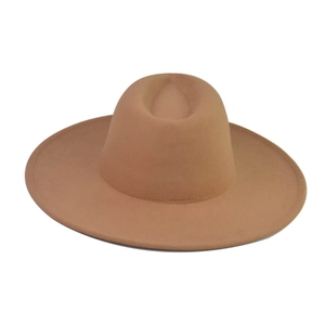 Close-up of a camel wool felt flat top fedora with a structured wide brim design