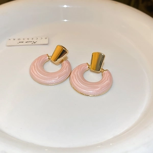 Elegant pink enamel hoop earrings with golden polished clips for a stylish look