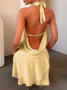 Elegant back view of light yellow glittery halter neck mini dress with backless detail