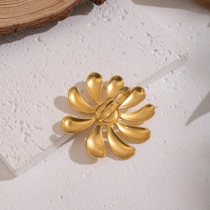 Elegant gold daisy flower open ring in stainless steel displayed on a natural stone base