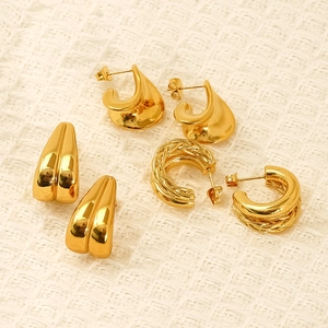 Three pairs of polished gold titanium steel hoop earrings with woven and smooth textures