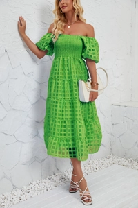 Detail of light green off-shoulder tiered maxi dress with textured puff sleeves and mesh fabric