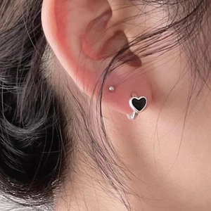 Sterling silver hoop earrings featuring a glossy black heart pendant and ball stud accent