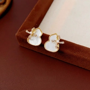 Gold-plated gourd stud earrings with mother-of-pearl and crystal bow details