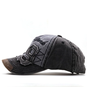 Close-up of vintage washed grey baseball cap featuring York embroidery and distressed detail