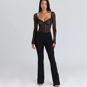 Detail of a black lace long sleeve bodysuit with corset style design and mesh patchwork