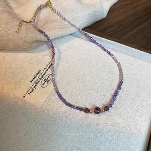 Elegant purple amethyst beaded necklace with gold spacers and adjustable chain link