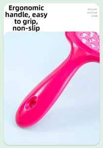 Detail of rose pink hollow massage comb with an ergonomic thick handle and hanging hole