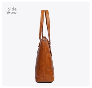 Side view of large brown faux leather tote bag with glossy finish and silver rings