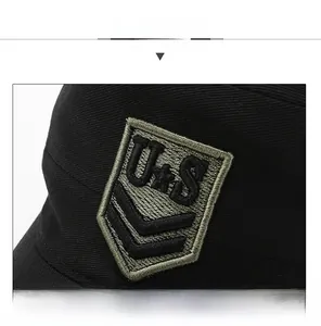 Detailed close-up of the military-style embroidery on a black cotton cadet hat