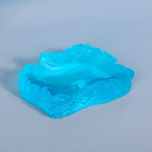 Blue ocean wave resin ornament with irregular ice texture and translucent finish