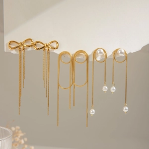Three styles of 18K gold stainless steel tassel earrings with bow, oval, and pearl charms