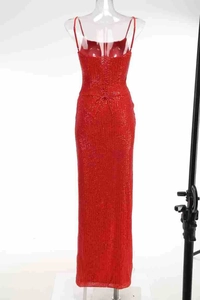 Detailed back view of red sequin evening gown with cross-strap open back design