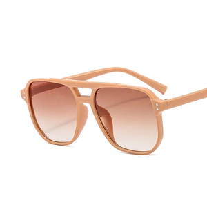Classic double-bridge aviator sunglasses with pink frames and gradient brown lenses