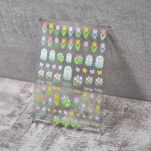 Detail of ultra-thin tulip nail art stickers featuring floral patterns and butterfly motifs