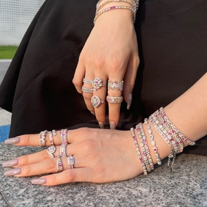 Close-up of S925 sterling silver bracelets with colorful zircon flowers and butterfly charms