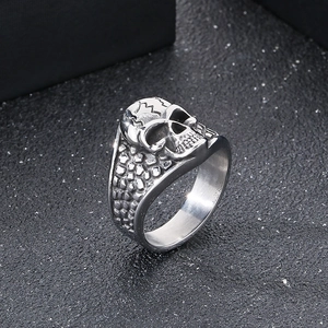 Macro detail of punk skull ring with textured silver stainless steel and vintage finish