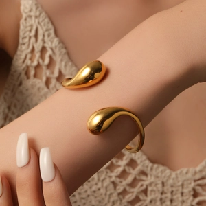 Minimalist gold teardrop open cuff bracelet in titanium steel for a modern look