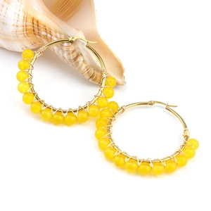 Golden stainless steel hoop earrings with yellow natural stone beads in boho style