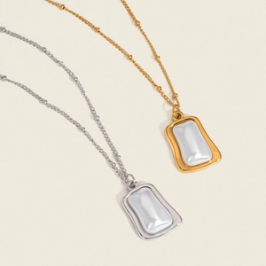 Gold and silver irregular rectangle pearl necklaces with textured molten metal borders