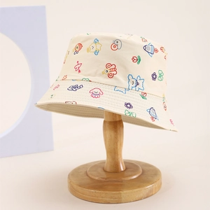 Detail of beige kids bucket hat with colorful embroidered cartoon animals and flowers