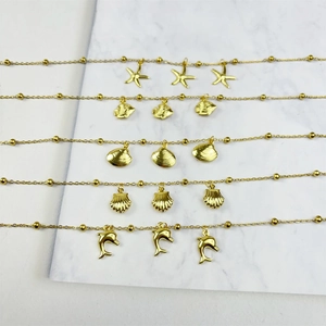 Gold-plated stainless steel marine collection necklaces with starfish and shell pendants