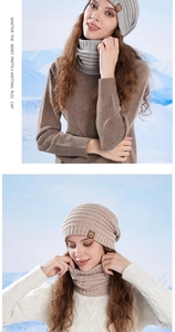 Detail of warm knitted beanie and neck gaiter set with vertical rib texture and leather logo